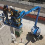 Z-45/XC working on construction site at theight with xtra tools and 2 operators