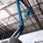 Genie Z40/23 NRJ articulating boom good reach to ceiling in warehouse with bent jib
