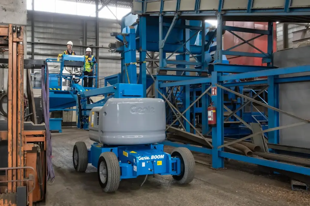 Genie Z45/25 JDC articulating boom working outdoor in narrow aisle in warehouse