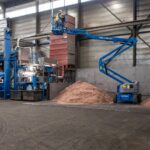 Genie Z45/25 JDC articulating boom working outdoor in scrap yard